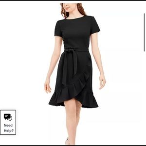 Short ruffled black dress with gold zipper. Never worn